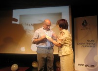 Astghik Gevorgyan, President of Journalists Union of Armenia, awarded YPC President Boris Navasardyan with a gold medal